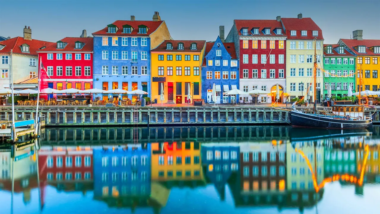 Colourful homes line Nyhavn Canal, Copenhagen, Denmark