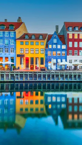 Colourful homes line Nyhavn Canal, Copenhagen, Denmark